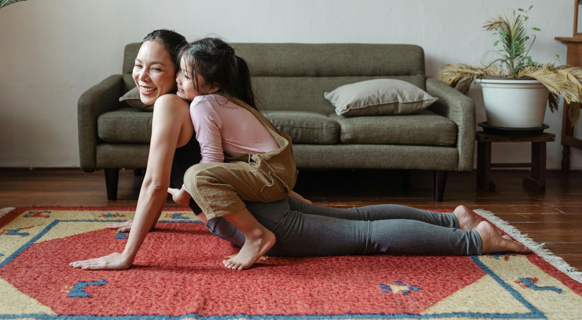 Photo of Girl Hugging Her Mom While Doing Yoga Pose